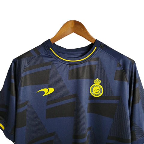 Camisa Al-Nassr Treino 23/24 - Torcedor Dunes Masculina - Azul com detalhes em preto e amarelo